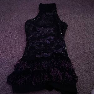 Black and purple sequin leotard with fringe on the bottoms
